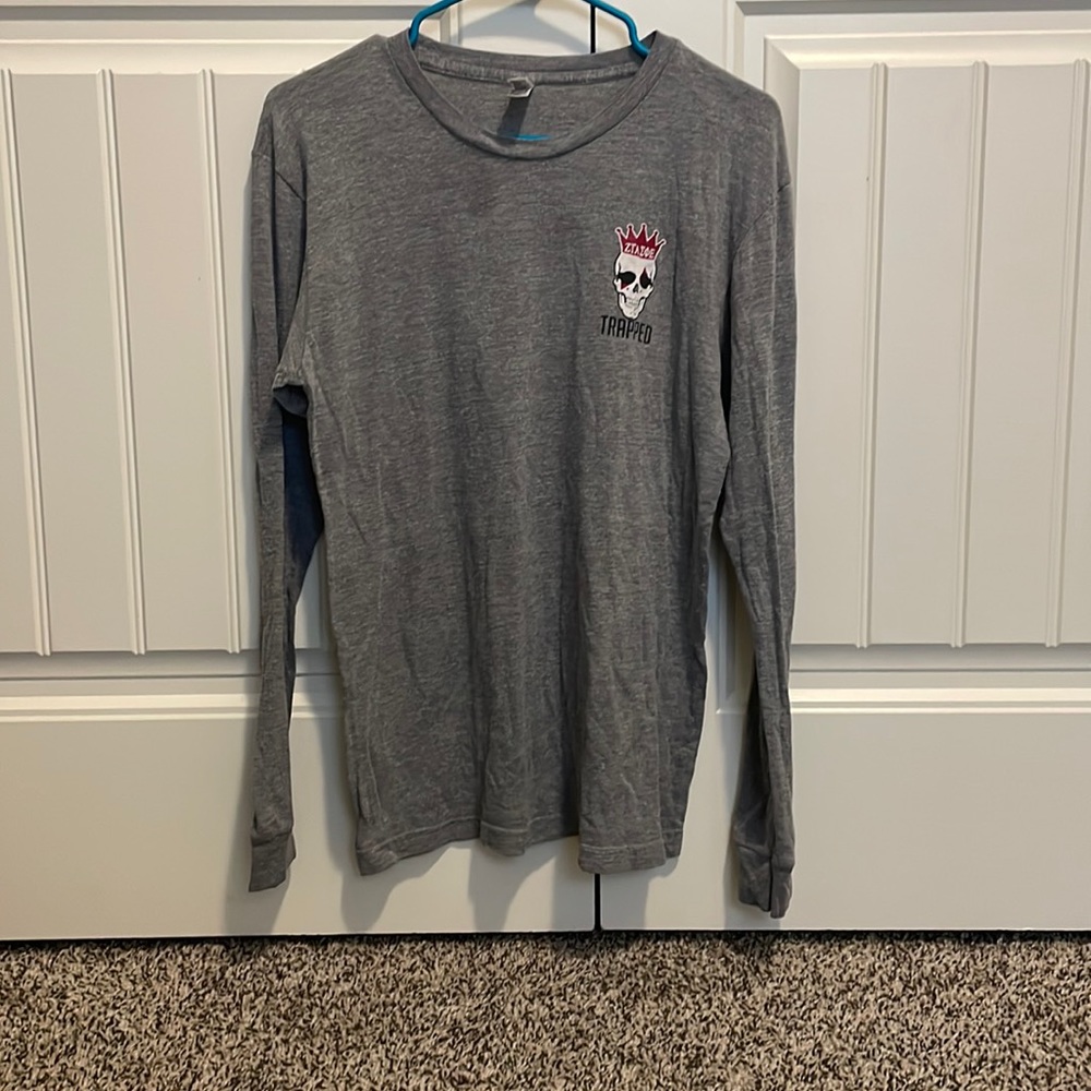 Grey long sleeve T-shirt. Seeing on the front and back. Size Medium.